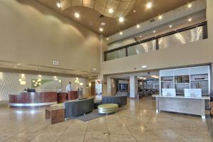 a lobby of a hospital with desks and chairs at Holiday Inn & Suites Albuquerque-North I-25 by IHG in Albuquerque +44 photos