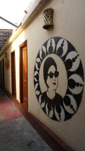 a painting of a woman on the side of a building at Dahab Hostel in Cairo