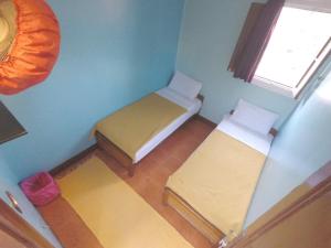 Ένα ή περισσότερα κρεβάτια σε δωμάτιο στο Dahab Hostel