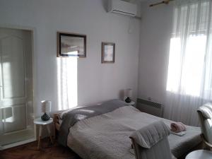 Uma cama ou camas num quarto em Citadela