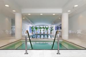 a swimming pool in a hotel lobby at SoHo Hotel Toronto in Toronto