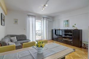 a living room with a couch and a table at Apartment Riva in Senj