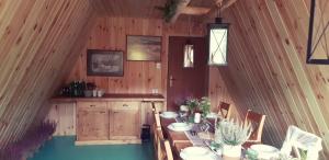 a dining room with a table in a cabin at Bacówka PTTK Jaworzec in Wetlina