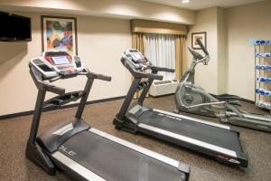 two exercise bikes in a gym with a room at Holiday Inn Express & Suites - Sharon-Hermitage, an IHG Hotel in West Middlesex