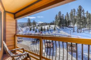 a balcony with a view of a ski slope at Ski Run C8 in Angel Fire