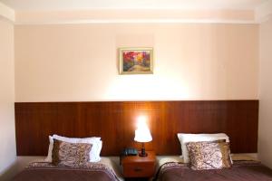 Postel nebo postele na pokoji v ubytování Rio Hotel