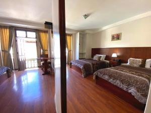 Postel nebo postele na pokoji v ubytování Rio Hotel