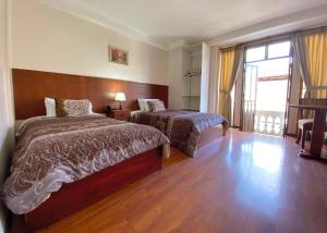 Postel nebo postele na pokoji v ubytování Rio Hotel