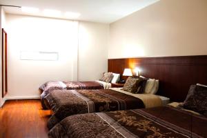 Postel nebo postele na pokoji v ubytování Rio Hotel