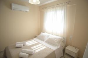 Postel nebo postele na pokoji v ubytování Mistral Apartments