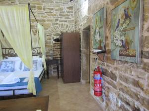 a room with a fire extinguisher on the wall at Vouno Village Apartments in Vounós
