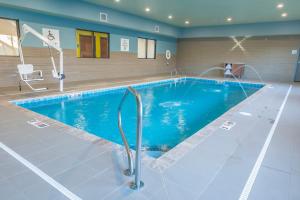 a large swimming pool in a hotel room at Holiday Inn Express & Suites Clarion, an IHG Hotel in Clarion