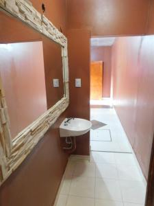 a bathroom with a sink and a mirror at Hospedaje Sol de Reyes Jujuy in Reyes +31 photos