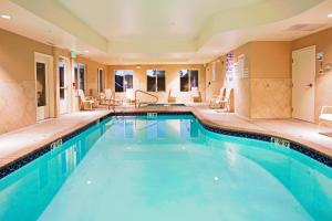 a large swimming pool in a large room at Holiday Inn Express Reno Airport, an IHG Hotel in Reno