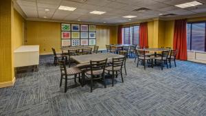 a conference room with tables and chairs in it at Holiday Inn Express Hotel & Suites London by IHG in London +30 photos