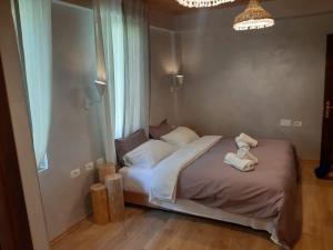 Postel nebo postele na pokoji v ubytování Hotel Restaurant Alpet Theth