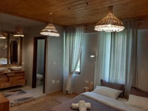 Postel nebo postele na pokoji v ubytování Hotel Restaurant Alpet Theth