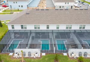 an aerial view of a building with blue windows at Windsor at Westside in Kissimmee