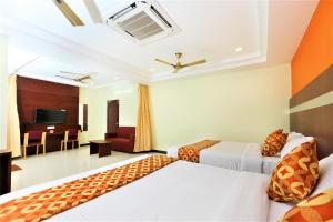 Postel nebo postele na pokoji v ubytování Hotel Ramcharan Residency, Tirupati + 32 fotografií
