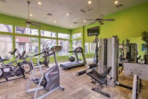 a gym with several treadmills and exercise bikes at Modern Condo with Pool about 3 Mi to Downtown Phoenix! in Phoenix