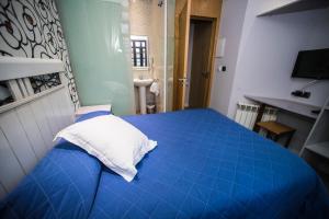 Postel nebo postele na pokoji v ubytování Hostal Centro