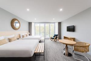 Abode Malua Bay客房内的一张或多张床位