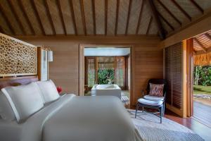 Voodi või voodid majutusasutuse Four Seasons Resort Bora Bora toas
