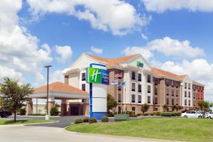 a front view of a hotel with a gas station at Holiday Inn Express Hotel & Suites Shawnee I-40, an IHG Hotel in Shawnee
