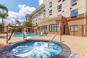 a hot tub in front of a building at Holiday Inn Express & Suites - Pharr, an IHG Hotel in Pharr