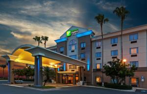 a rendering of a hotel at night at Holiday Inn Express & Suites - Pharr, an IHG Hotel in Pharr