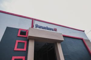 a building with a sign on top of it at RedDoorz near Jalan Soeprapto Bengkulu in Bengkulu