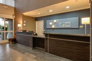 a lobby of a hotel with a reception desk at Holiday Inn Express & Suites Santa Clara, an IHG Hotel in Santa Clara