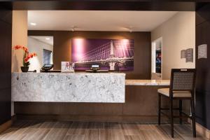 a bar in a hotel with a picture of a bridge at Staybridge Suites - St George, an IHG Hotel in St. George