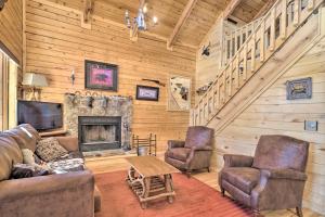 a living room with a couch and chairs and a fireplace at Log Cabin with Mountain Views about 30 Mi to Pikes Peak! in Florissant