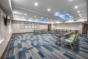 a conference room with a table and chairs at Holiday Inn Express & Suites - Houston Westchase - Westheimer, an IHG Hotel in Houston