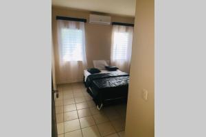 Ένα ή περισσότερα κρεβάτια σε δωμάτιο στο Hai Suite Apartamento