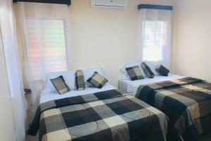 Ένα ή περισσότερα κρεβάτια σε δωμάτιο στο Hai Suite Apartamento