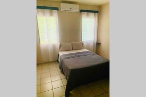 Ένα ή περισσότερα κρεβάτια σε δωμάτιο στο Hai Suite Apartamento