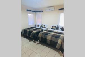 Ένα ή περισσότερα κρεβάτια σε δωμάτιο στο Hai Suite Apartamento