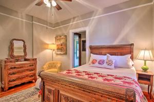 a bedroom with a bed and a dresser and a mirror at Charming 1916 Bungalow about 3 Miles to Augusta Course in Augusta