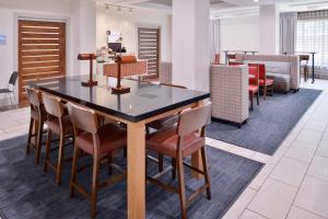 a dining room with a table and chairs at Holiday Inn Express Hotel & Suites San Antonio NW-Medical Area, an IHG Hotel in San Antonio
