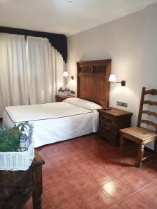 מיטה או מיטות בחדר ב-Hotel Artea Errota