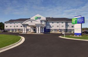 a large building with a sign in front of it at Holiday Inn Express & Suites North Fremont, an IHG Hotel in Fremont