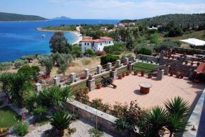 an aerial view of a house with a garden and the water at Vila Elena 2 astoning view in Steni Vala Alonissos