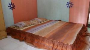 Postel nebo postele na pokoji v ubytování Homestay ENDRO