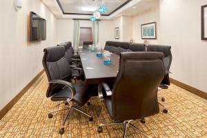 a conference room with a long table and chairs at Holiday Inn Express Hotel & Suites Houston NW Beltway 8-West Road by IHG in Houston +41 photos
