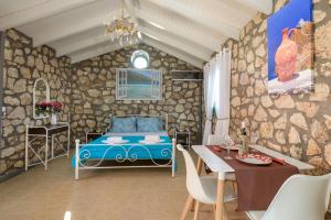 Postel nebo postele na pokoji v ubytování Sofias cottage Razata Argostoli