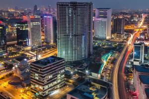 a city lit up at night with traffic at Crowne Plaza Istanbul Oryapark by IHG in Istanbul