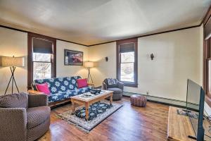 a living room with a couch and a table at Victory Victorian House - Walk to Dtwn Glenwood! in Glenwood Springs