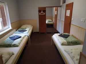 Postel nebo postele na pokoji v ubytování Penzion Zátiší